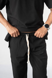 SCRUB ANTIFLUIDOS NEGRO HOMBRE